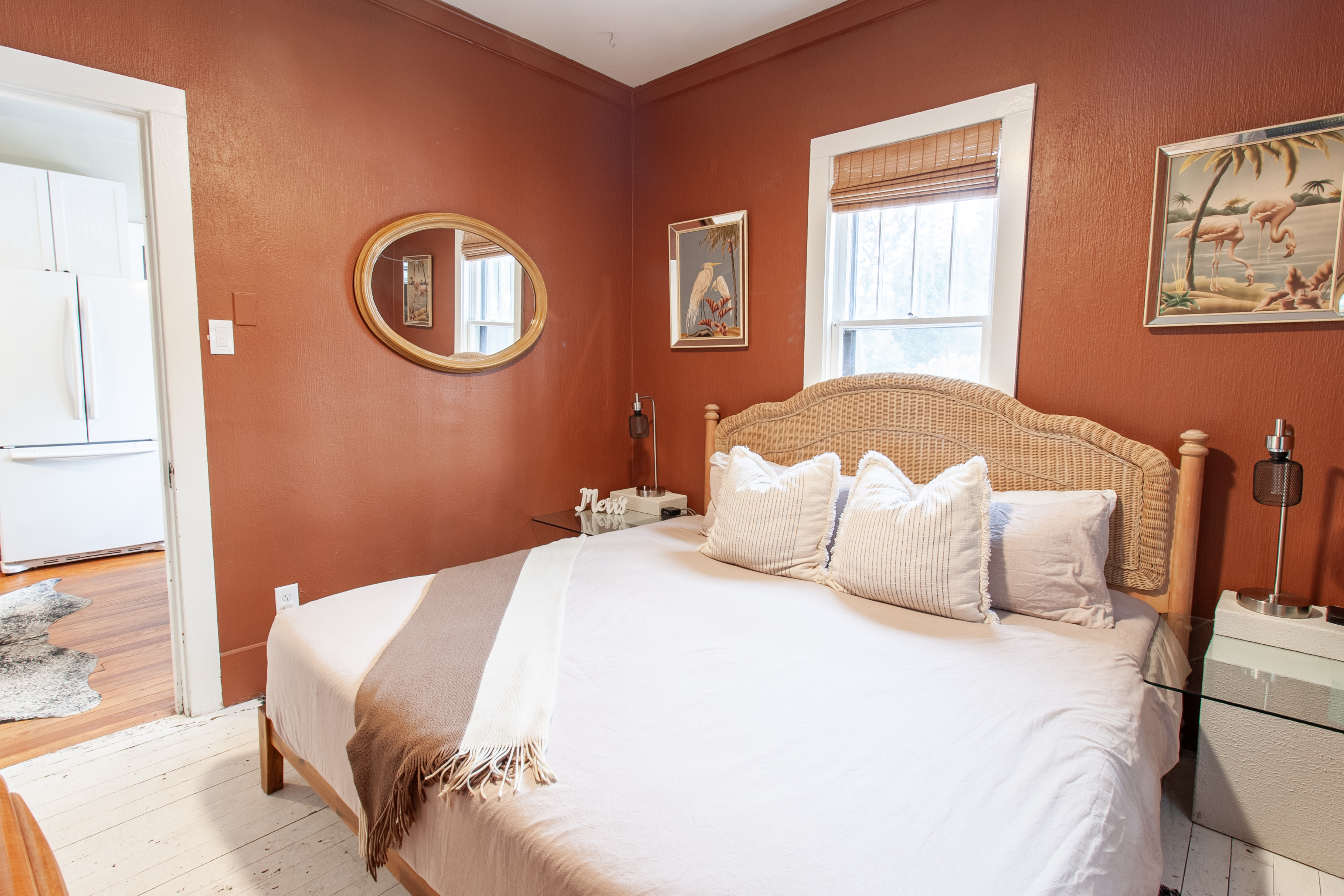 Bedroom with king bed and terracotta walls