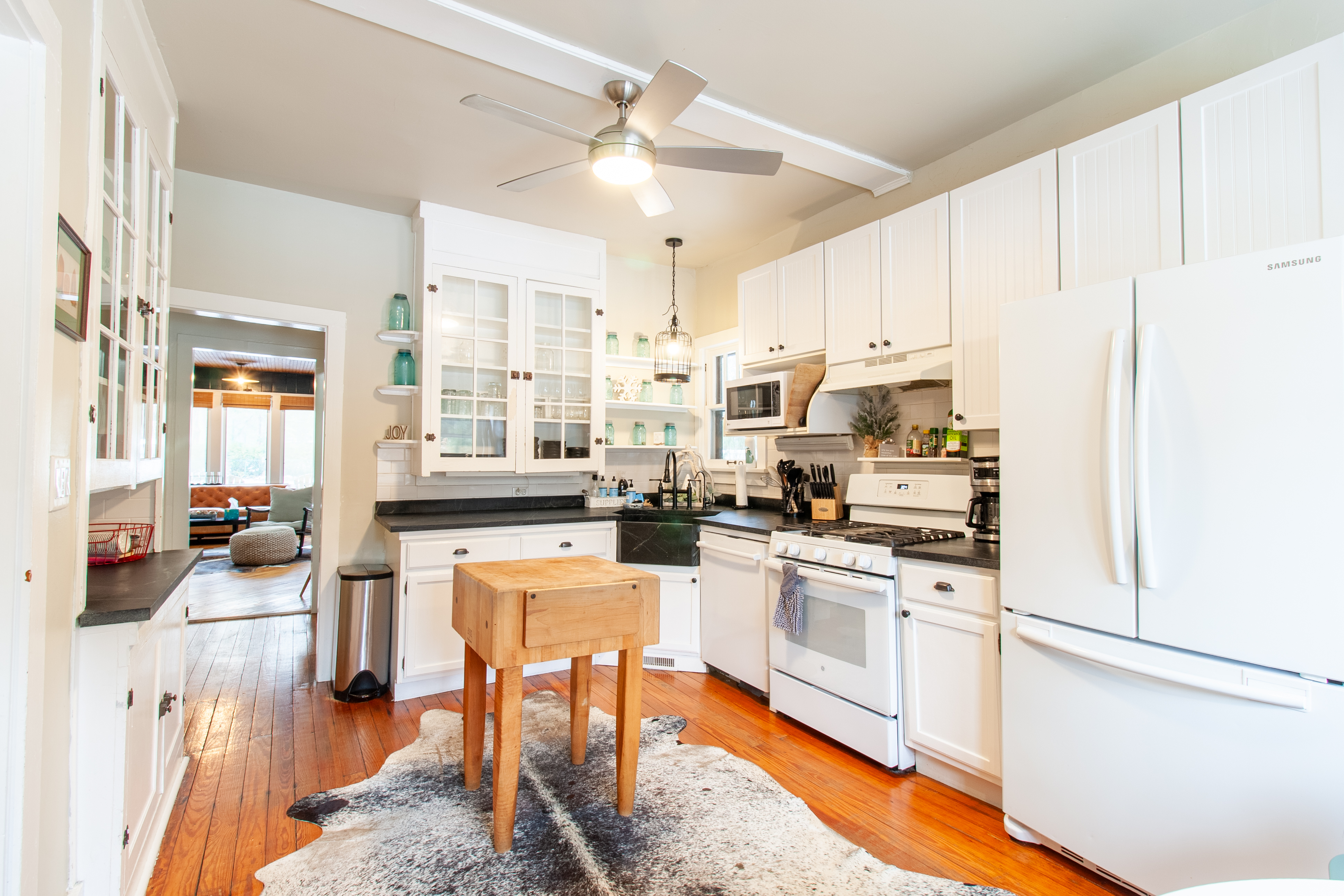 Kitchen with white cabinets and island