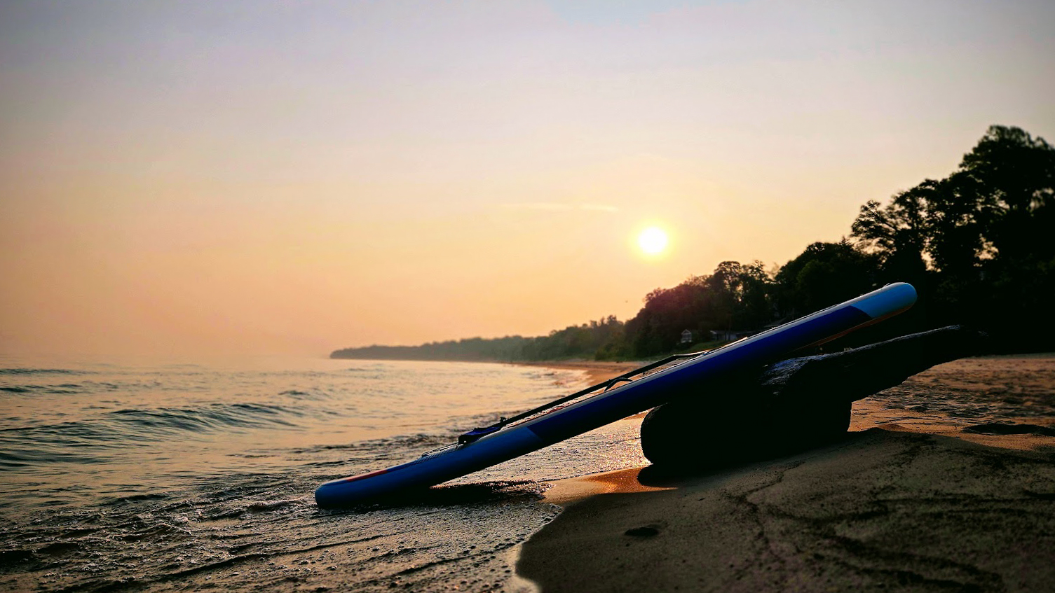 Sunset over Lake Michigan with kayak on the beach